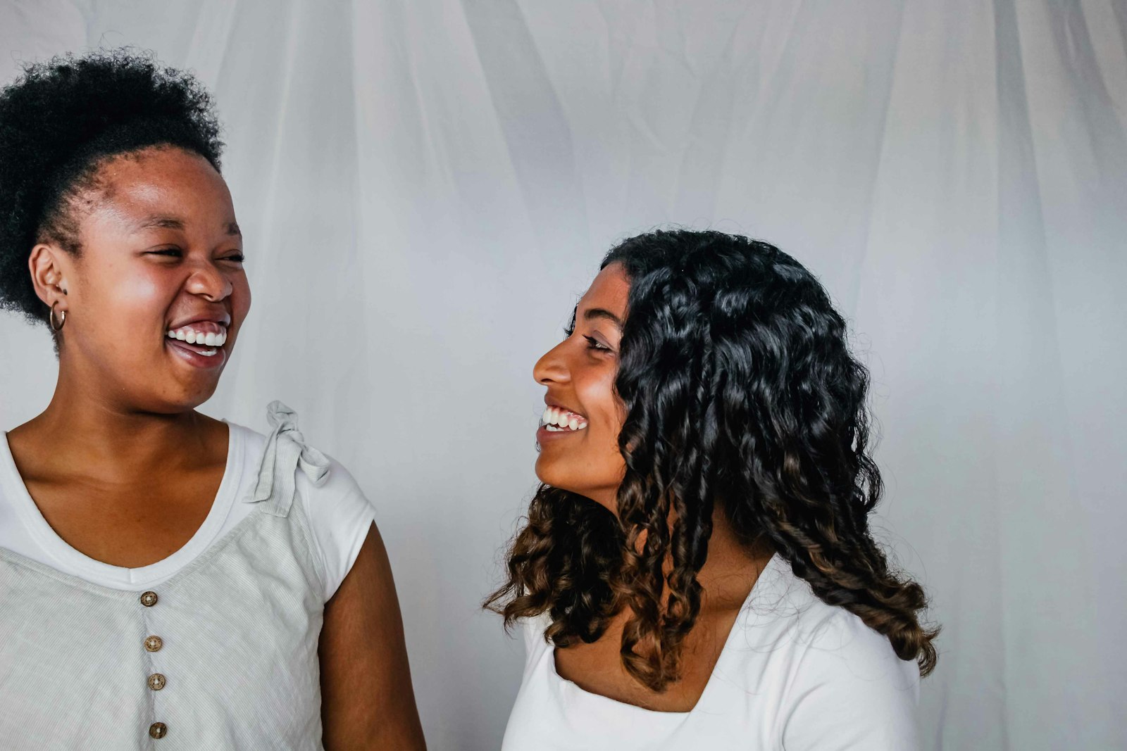 Two women laughing together